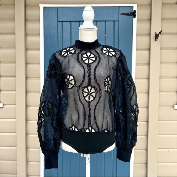 Boutique uptown bombshell Tops - Boutique Uptown Bombshell Cut Out Crochet
Bodysuit Top Women’s Size L